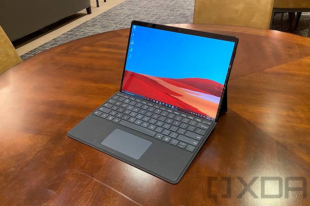 Surface Pro X in black on wooden table