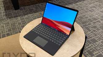 Surface Pro X in black on small table