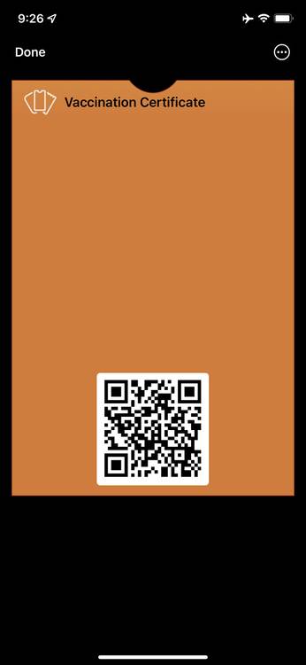 Mobile app screen showing QR code for vaccine certificate in Apple Wallet