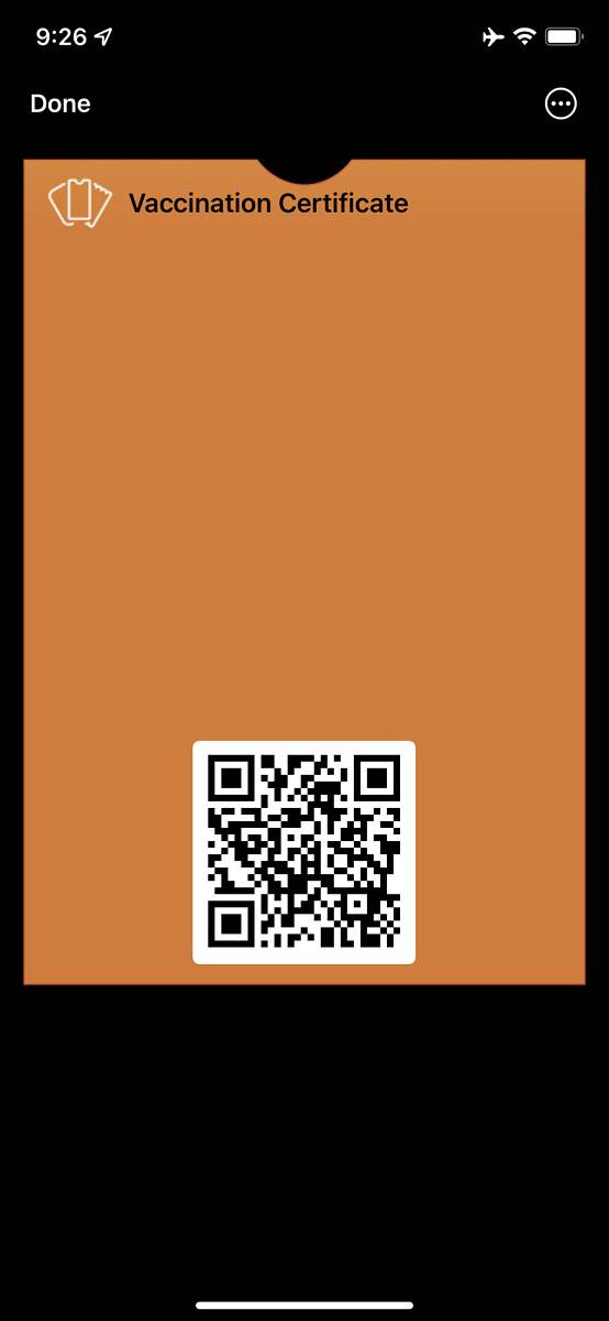 Mobile app screen showing QR code for vaccine certificate in Apple Wallet