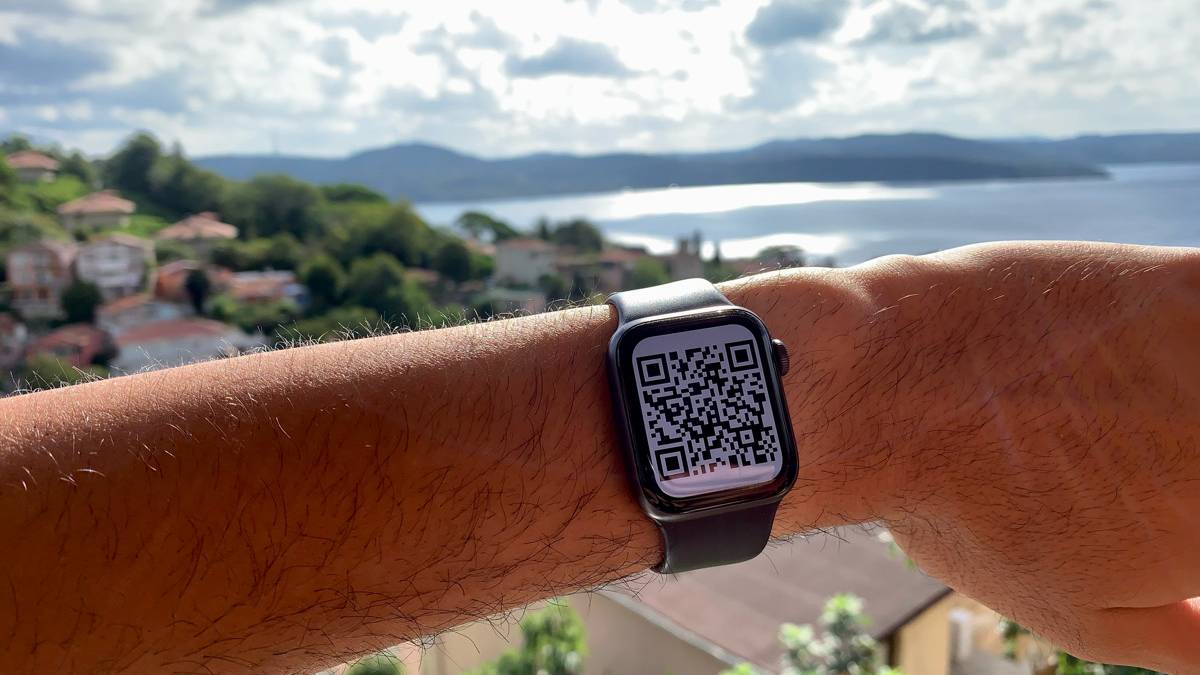 Worn Apple Watch displaying vaccination QR code