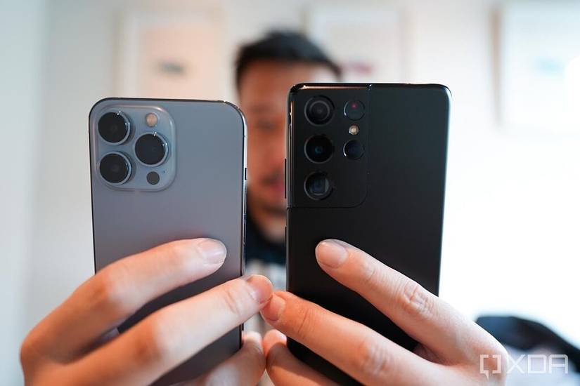 iPhone 13 Pro and Galaxy S21 Ultra in the hand.