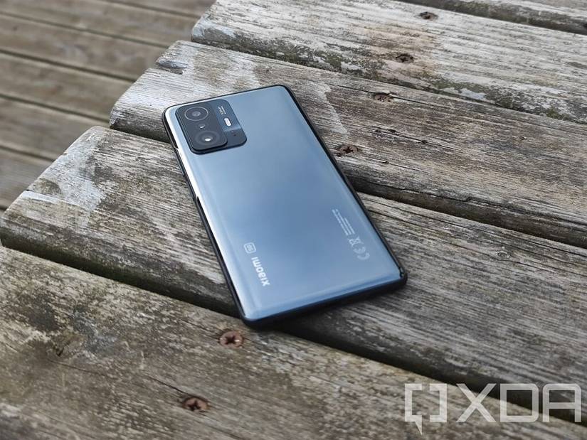 Xiaomi 11T Pro lying on its back on a wooden table