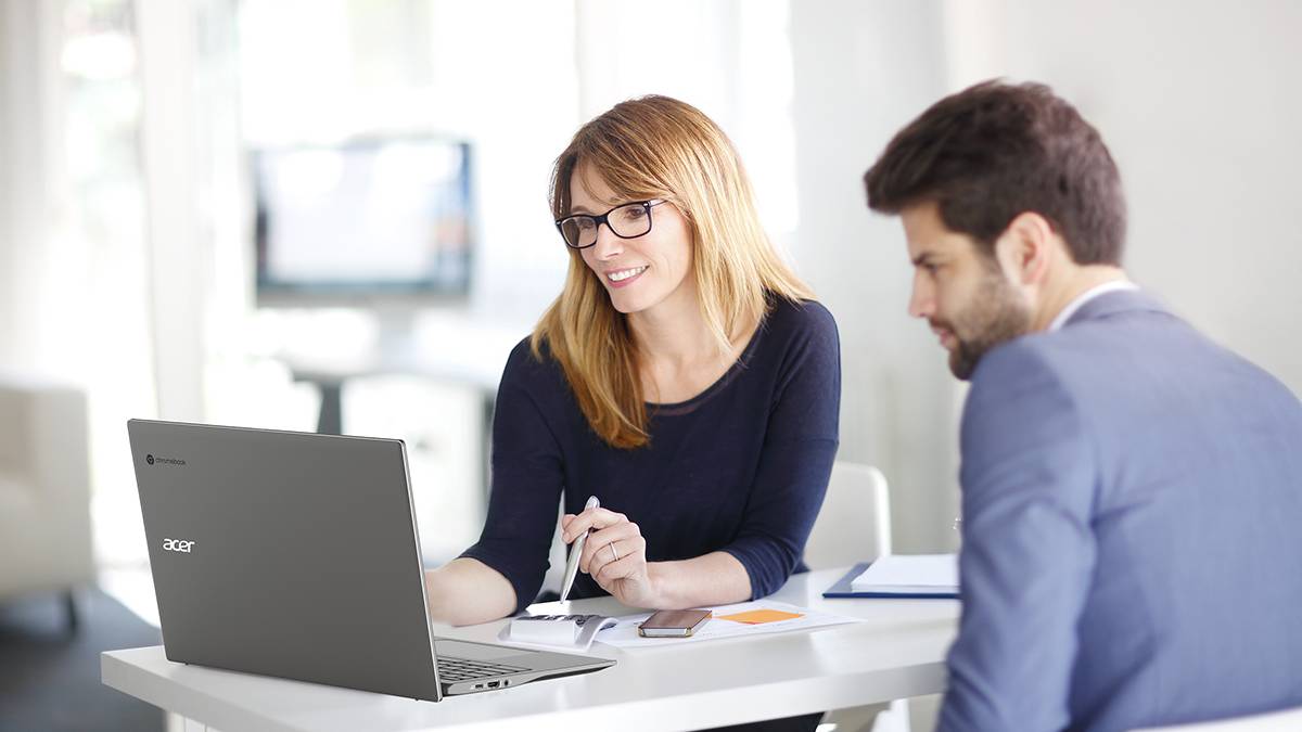 Man and woman looking at laptop screen