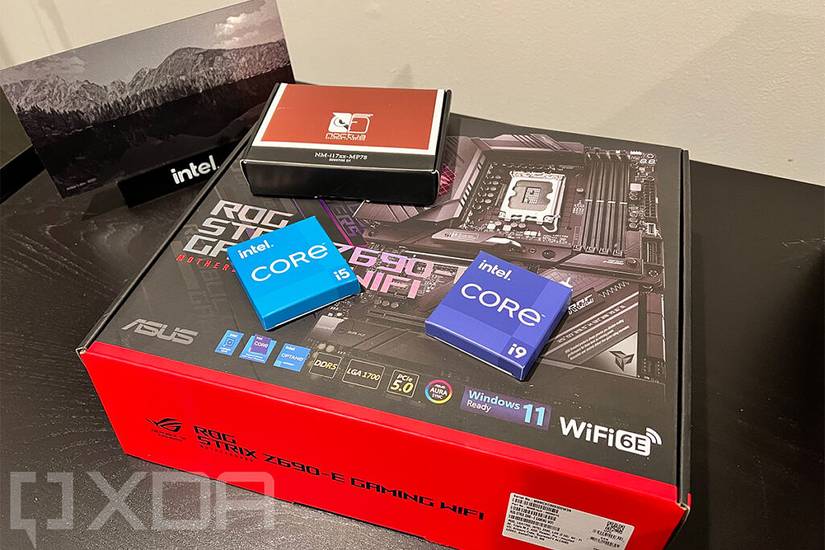 Intel Core parts and motherboard on black desk