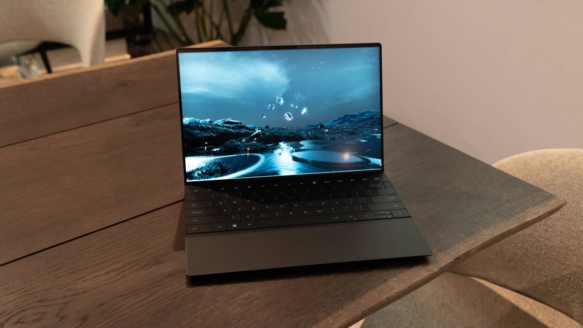 Black laptop on brown table