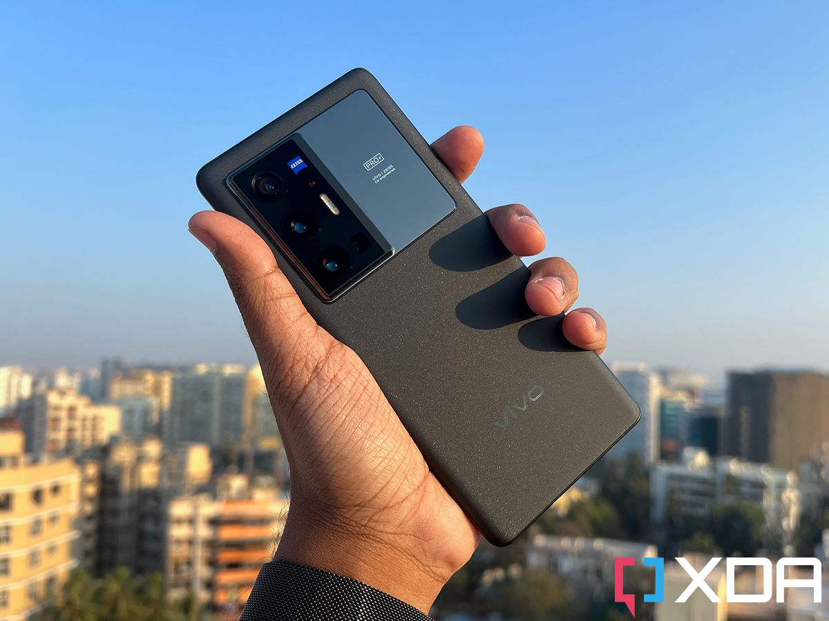 Vivo X70 Pro Plus in Black color held out in hand