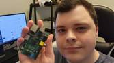 Selfie photo holding up a Raspberry Pi