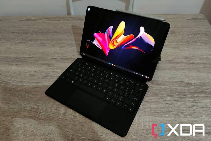 HUAWEI MateBook E with Smart Magnetic Keyboard and M-Pencil seen at a front right angle
