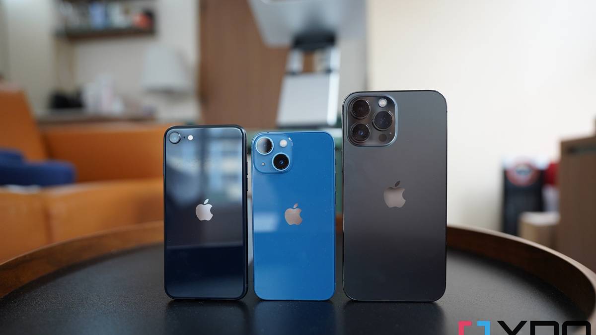 Various iPhones on a circular table.