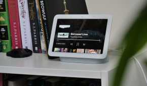 Google Nest Hub 2nd Generation on a white shelf with books