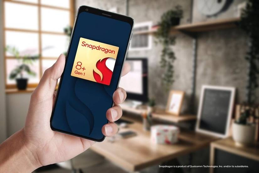 Qualcomm Snapdragon 8 Gen 1 Plus reference design smartphone in hand with home office in background