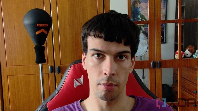 Close-up picture of a man sitting on a chair