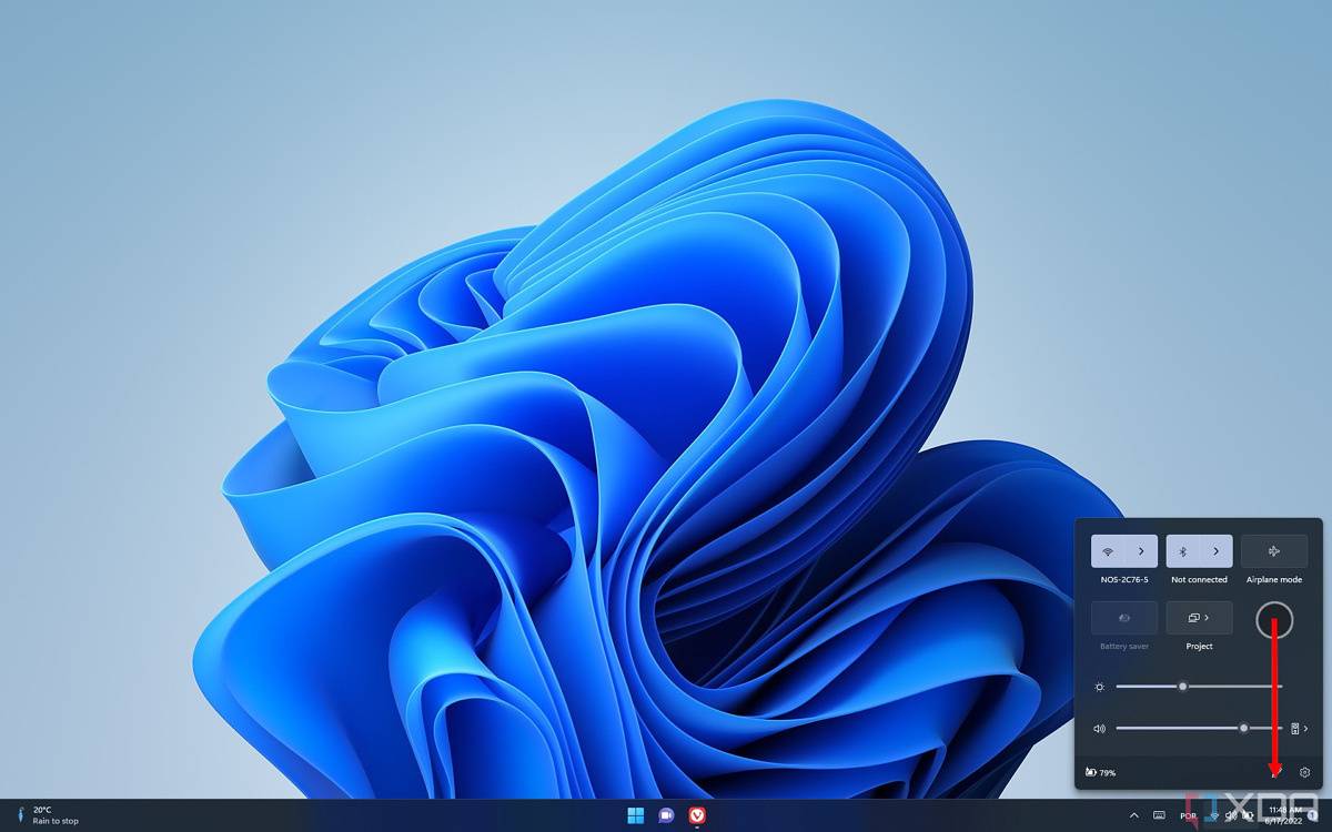 Image showing how swiping down on an empty area of the Quick Settings panel closes it