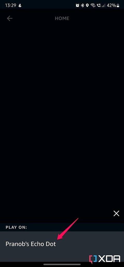 Screenshot of Amazon Alexa app speaker selection pop-up with arrow pointing at button.