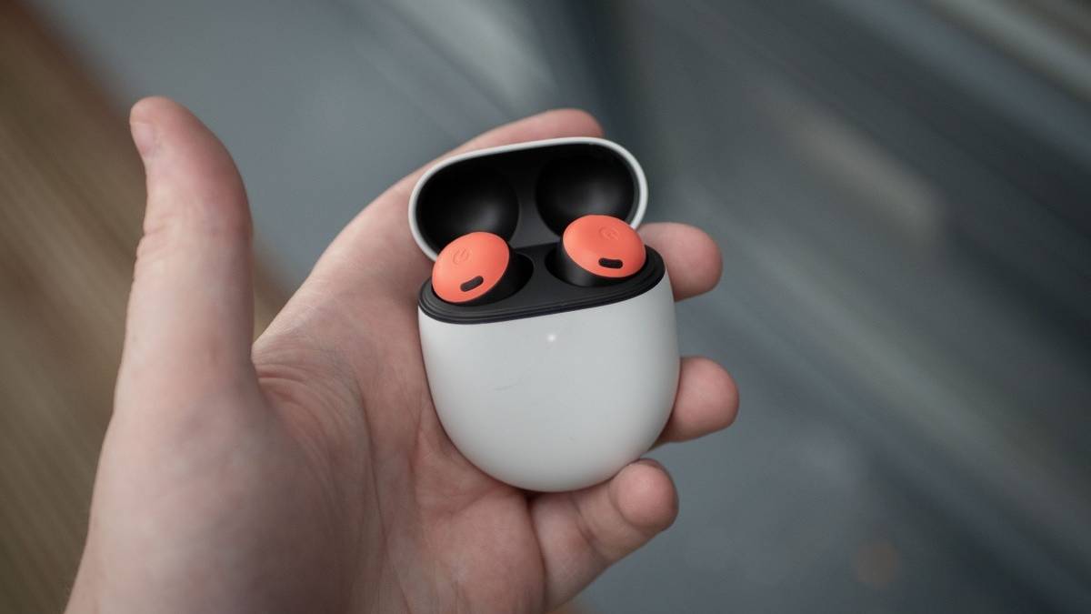 Google Pixel Buds in the case, held in hand