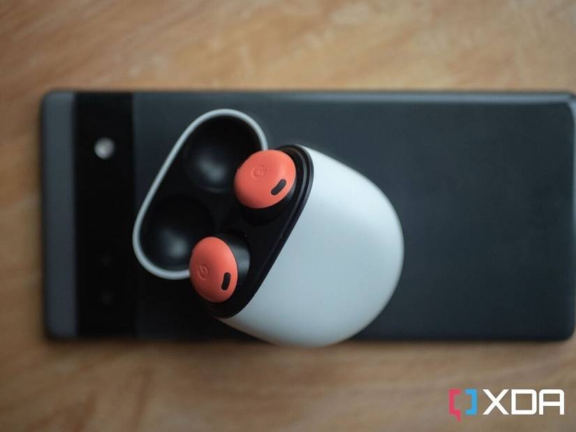 google pixel buds pro in the case on top of a google pixel 6a