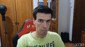 A picture of a man sitting on a chair with furniture behind him. The picture was taken with the Insta360 Link webcam with the HDR feature disabled