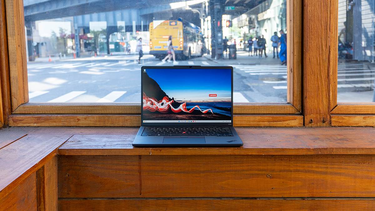 Laptop with a street and cars in the background