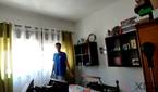A picture of a man standing in front of a window with strong sunight outside. Nothing is discernible outside the window due to the strong light. The picture is a sample taken from a video recorded with the Obsbot Tiny 4K webcam