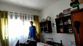 A picture of a man standing in front of a window with strong sunight outside. Nothing is discernible outside the window due to the strong light. The picture is a sample taken from a video recorded with the Obsbot Tiny 4K webcam
