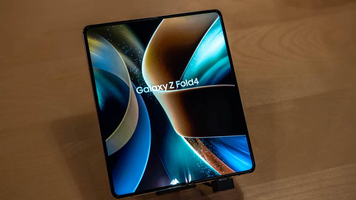 Samsung Galaxy Z Fold 4 on a stand on a wooden table