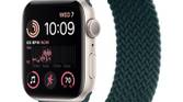 Starlight Apple Watch SE 2 with Braided Solo Loop band on white background.