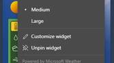 Windows 11 weather widget with dropdown menu open showing resizing and customization options