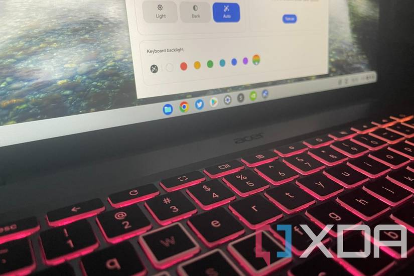 Close-up of the Acer Chromebook 516 GE's RGB keyboard lit up in pink.