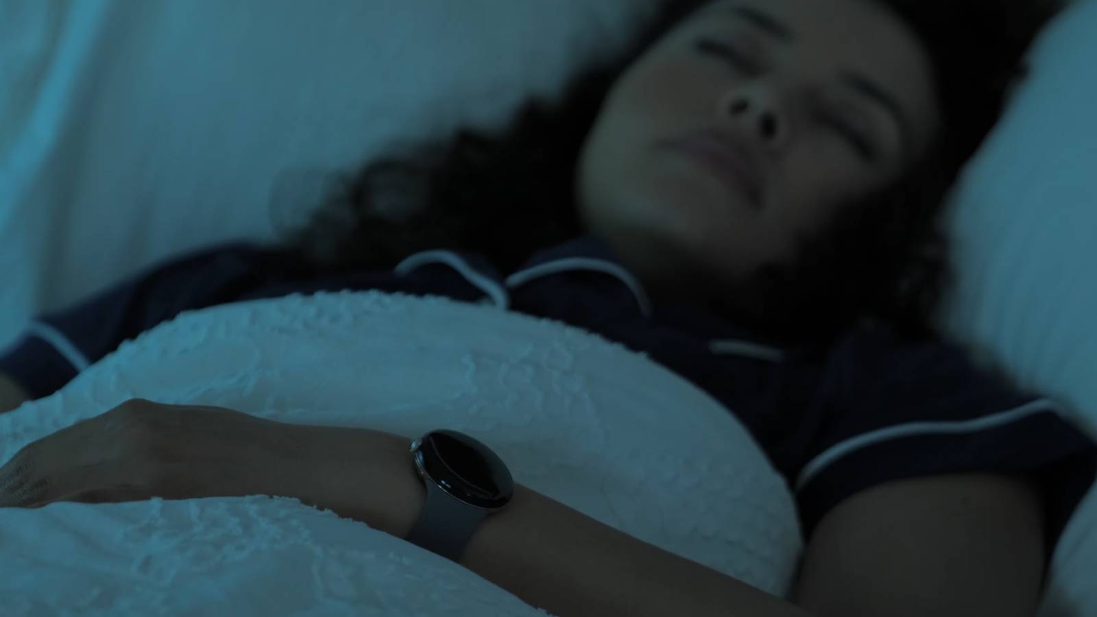 Person wearing the Google Pixel Watch to sleep.