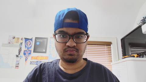 A man in a room, photo taken from Dell Pro Webcam