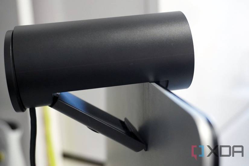 The Dell Pro Webcam mounted on a Surface Laptop Studio.