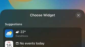 iPhone Lock Screen showing available widgets to choose from for the top section