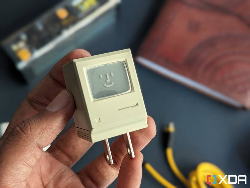 An image of a USB-C charger that resembles Apple's old Macintosh computer in beige color.
