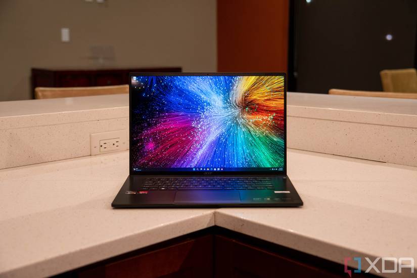 Laptop in the corner of white counter