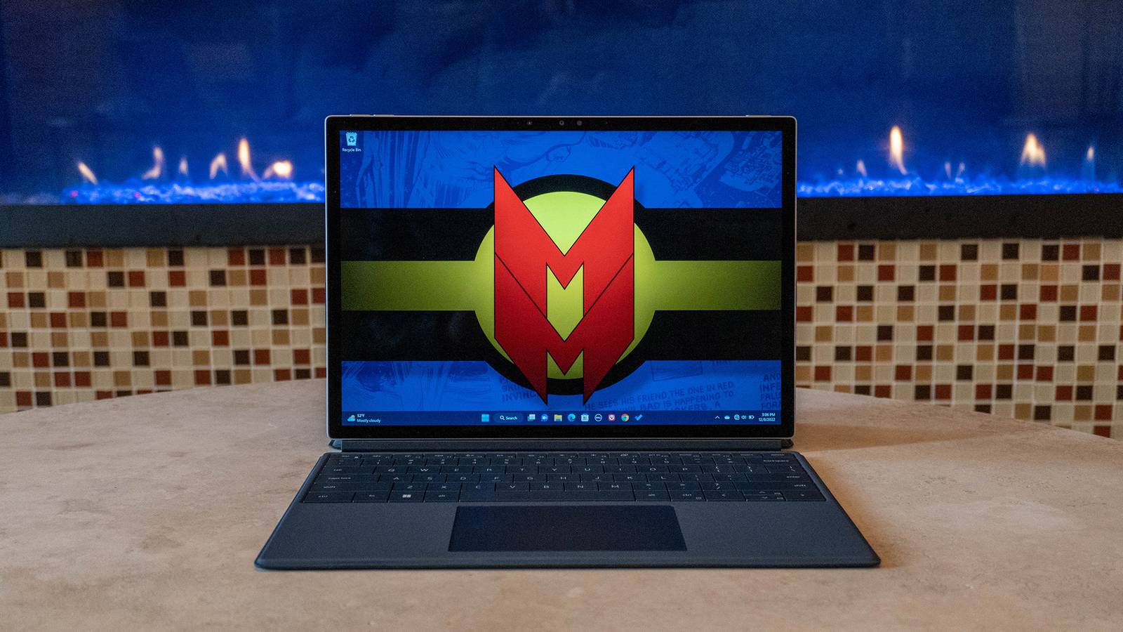 Dell XPS 13 2-in-1 on table with fireplace background