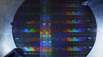 A silicon wafer of Intel CPUs moments before destruction.