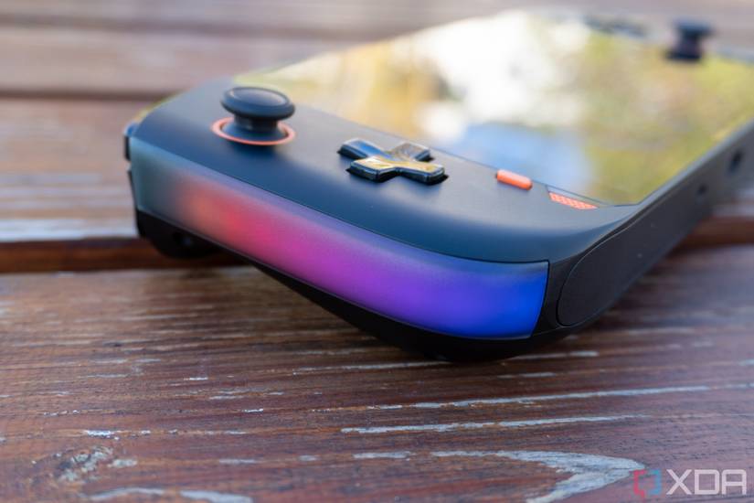 Close-up view of the RGB light strip on the left side of the One Xplayer Mini Pro, with lights in red, purple, and blue.