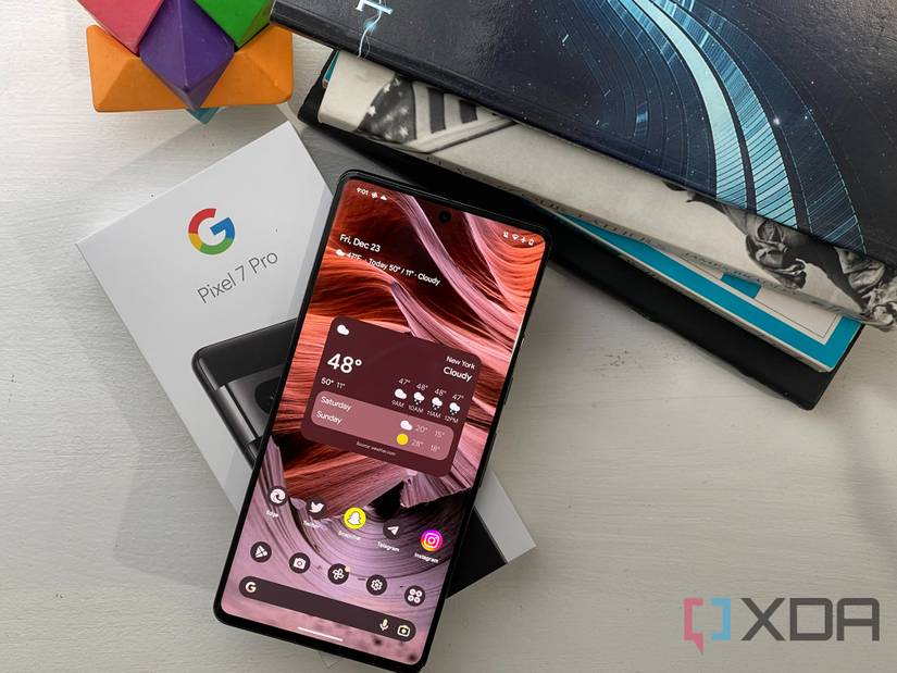 The Pixel 7 Pro with the box and books in the background