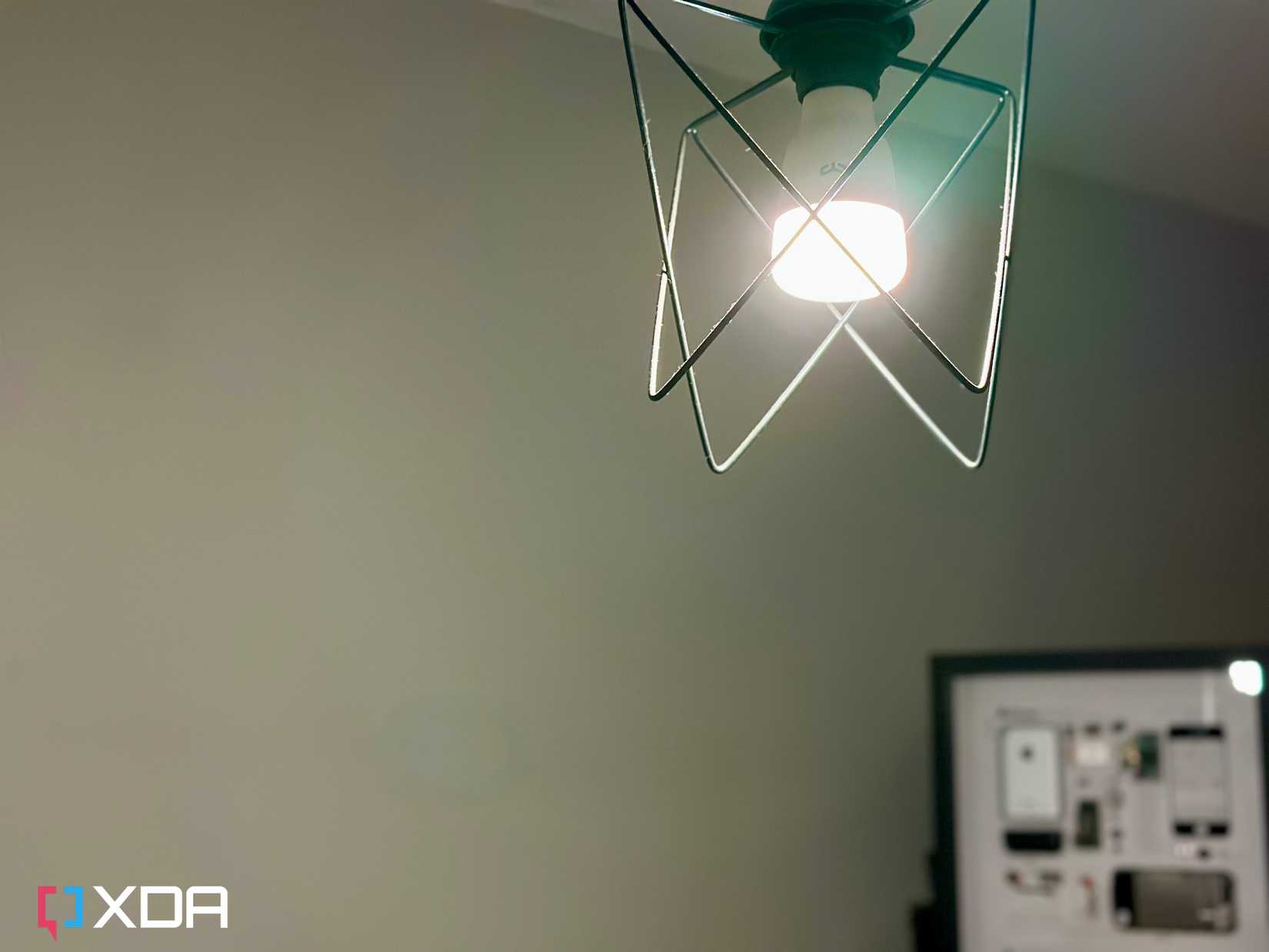 Yeelight HomeKit bulb for Apple Home with framed original iPhone in the background