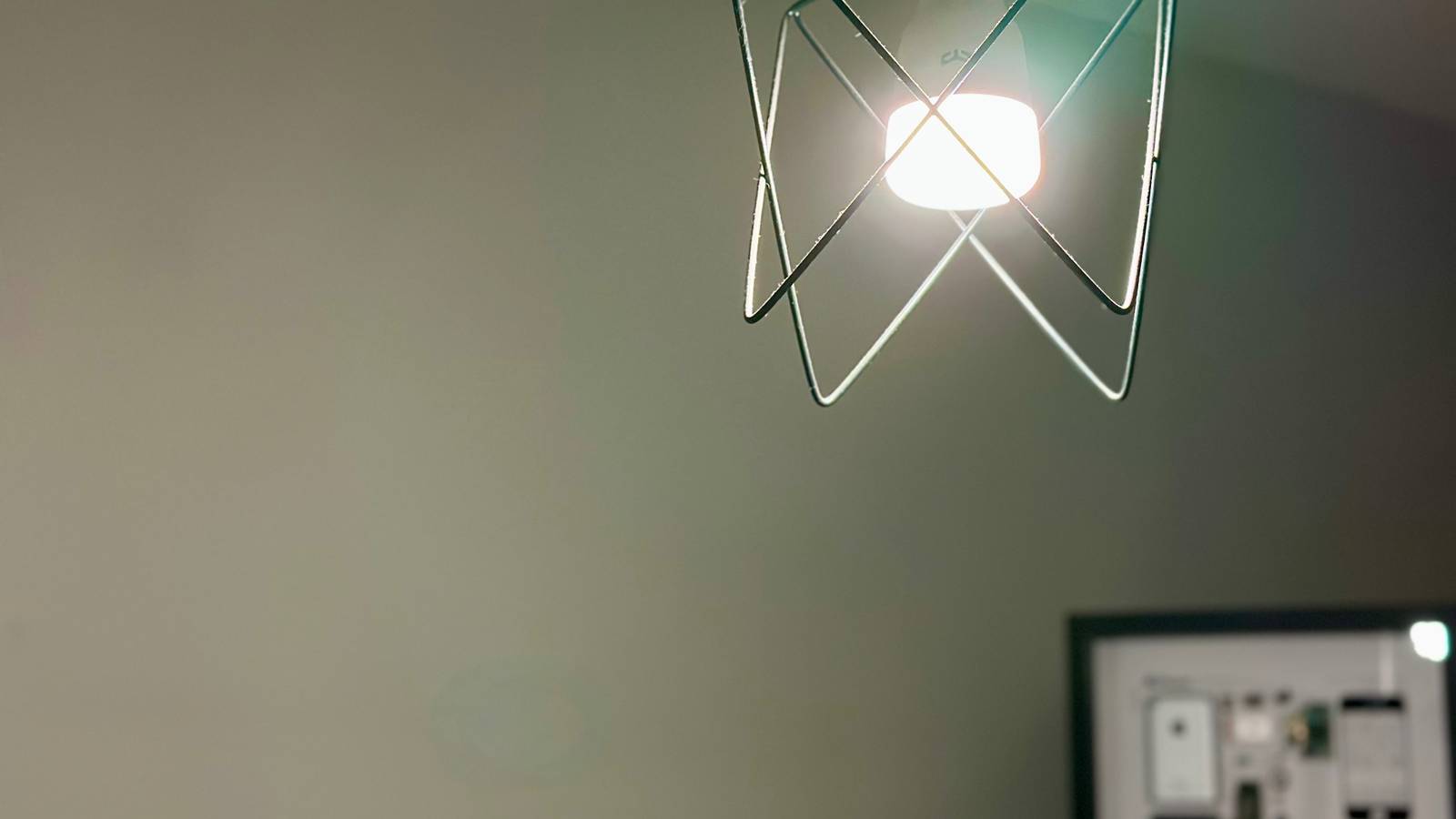 Yeelight HomeKit bulb for Apple Home with framed original iPhone in the background