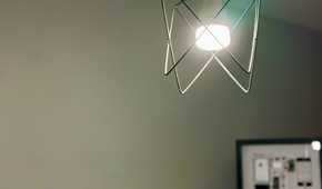 Yeelight HomeKit bulb for Apple Home with framed original iPhone in the background