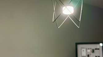 Yeelight HomeKit bulb for Apple Home with framed original iPhone in the background