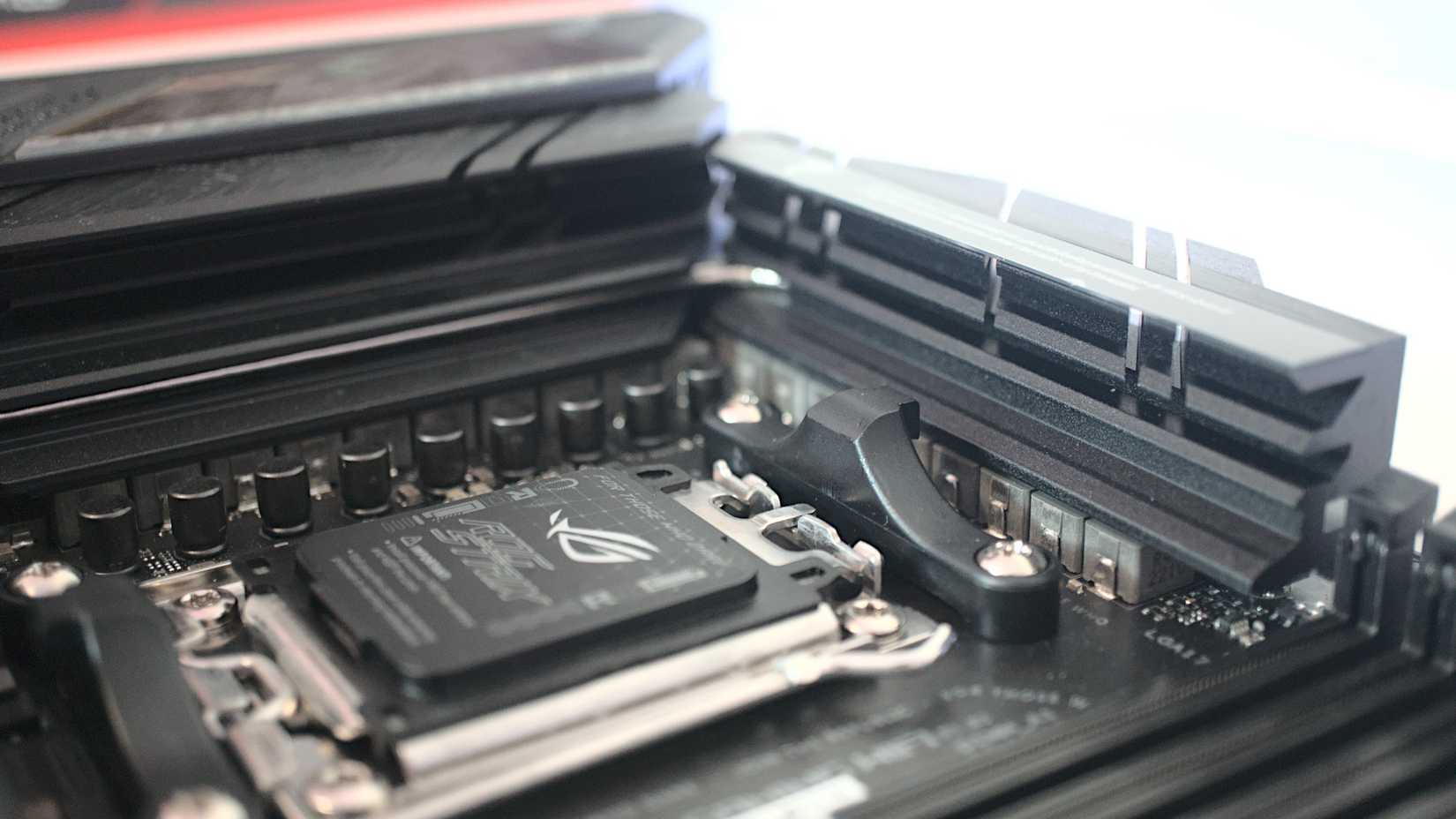 An image of the ASUS ROG Strix X670E-E Gaming WiFi motherboard, close-up shot.