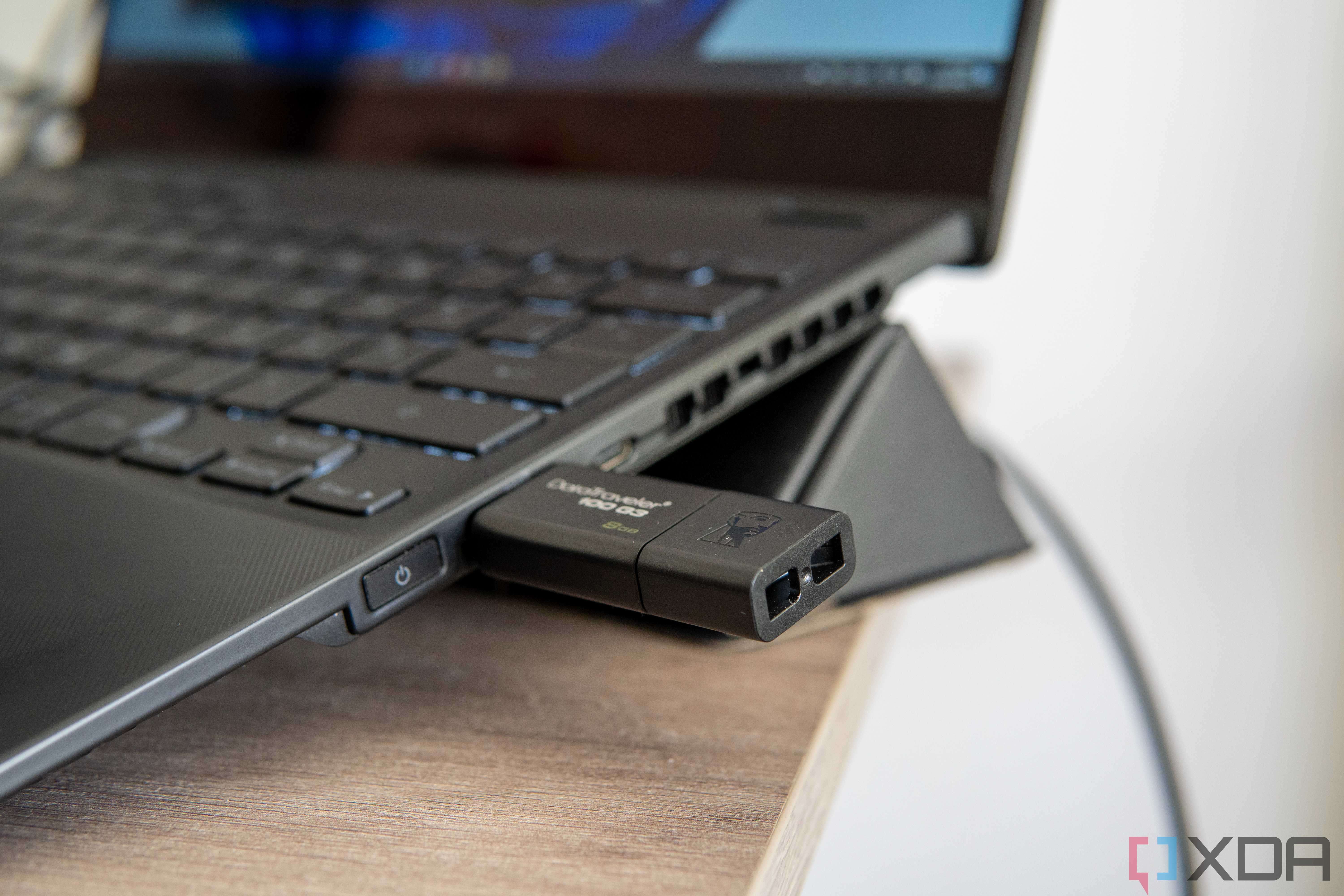 Close-up view of a USB flash drive plugged into a Windows 11 laptop