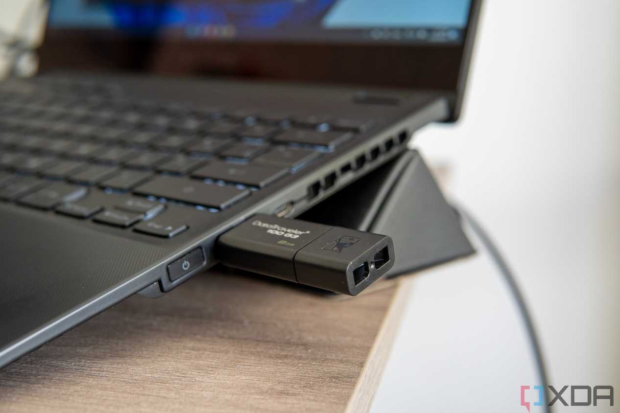 Close-up view of a USB flash drive plugged into a Windows 11 laptop