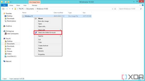 Screenshot of a Windows context menu in File Explorer, showing the option to select a drive letter and mount an ISO file using WinCDEmu.