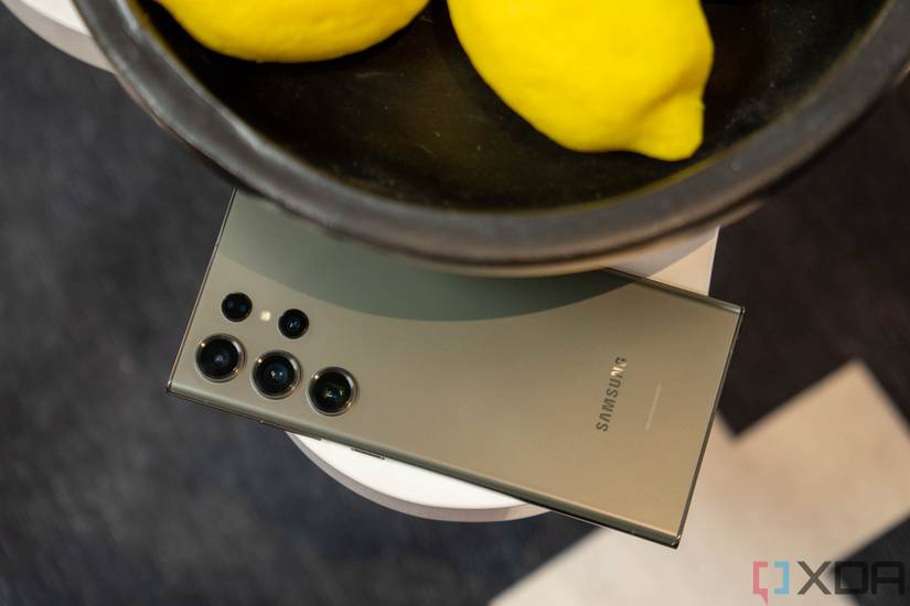 Green Samsung phone next t a bowl of lemons