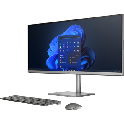 Angled front view of the HP Envy All-in-One 34 with a keyboard and mouse facing left