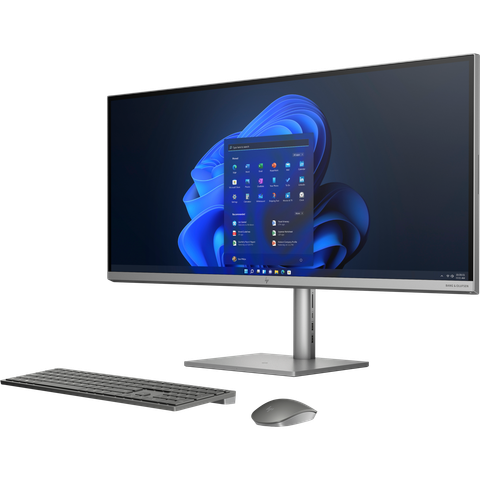 Angled front view of the HP Envy All-in-One 34 with a keyboard and mouse facing left